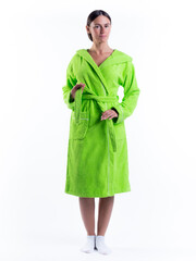 Fototapeta premium woman in a Bathrobe on an isolated white background with a smile on her face.