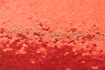 red shiny festive background of diamond confetti. gloss and gradient