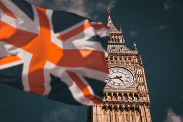Fototapeta na wymiar flag of UK waving in front of Big Ben and Westmister Abbey London UK