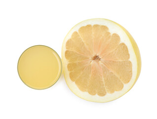 Glass of fresh pomelo juice and fruit isolated on white, top view
