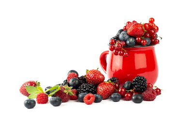 Berries. Ripe berries mixed assortment in red cup on white background. Summer or Spring Organic Berry background.