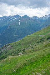 Naklejka premium Alpine mountains in Austria. Grosglockner road in fog