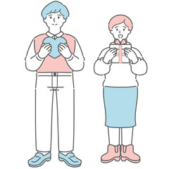 ハートのプレゼントを贈る幸せカップル