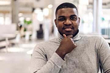 Naklejka premium Portrait of successful profile handsome attractive confident young black african creative business man look at camara at office