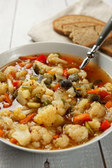 Cauliflower soup with eggplant and other vegetables. Vegan dish. 