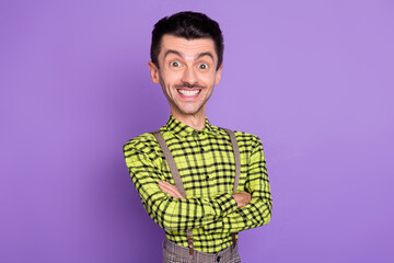 Photo of young positive joyful caricatured head man with crossed hands isolated on violet color...