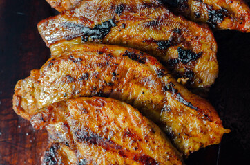 Fresh and juicy pork loin steaks,  grilled meats on the wooden board