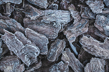 The texture of the pine bark. frosty mulch