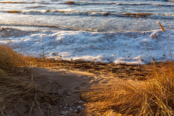 Ice piles at the Baltic sea in Tuja beach in sunset in January in Latvia
