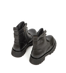 Woman's leather warm winter boots over white background