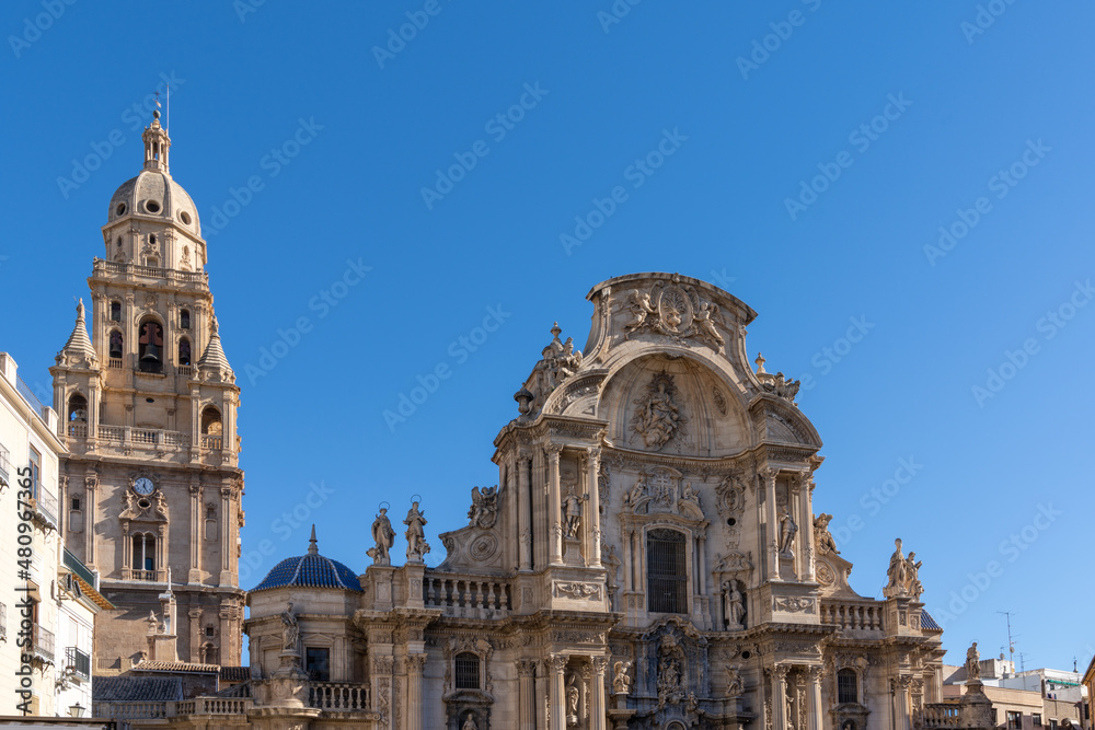 Wall mural close up view of the historic cathedral in Murcia under a cloudless blue sky