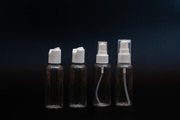 Set of transparent empty plastic bottles (containers) for cosmetics