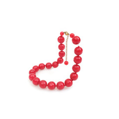 Red round beads isolated on white background