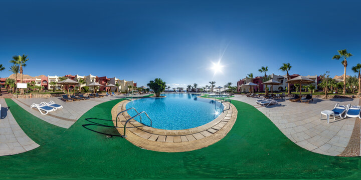 full seamless spherical  hdr 360 panorama near blue water pool on territory of elite hotel in desert on shores of  Red Sea in equirectangular projection. VR concept