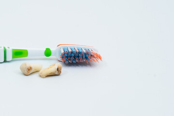 Damaged caries teeth with toothbrush on white background