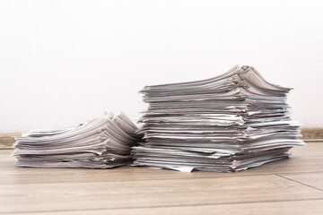 bundles bales of paper documents. stacks packs pile on the desk in the office. waste paper, paper trash