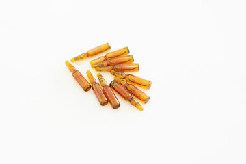 medical ampoule in pile isolated on white in cosmetics concept