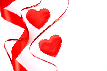 Valentines day background with hearts and red ribbons