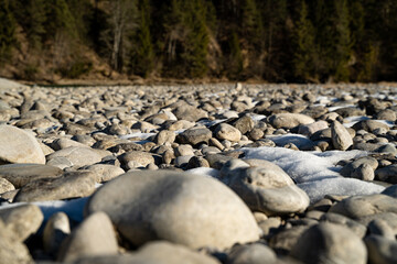 White rocks and stones at blue river