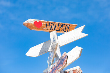 Isla Holbox sign in Mexico with a clear blue sky in the background
