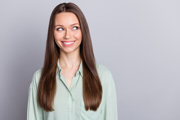 Obraz premium Photo of impressed manager brunette lady look empty space wear blue blouse isolated on grey color background