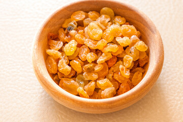 golden raisins close up in bowl