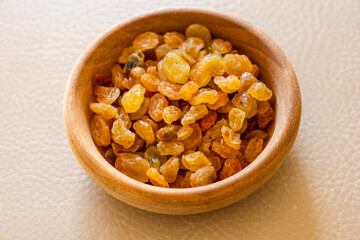 golden raisins close up in bowl