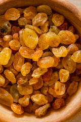 golden raisins close up in bowl