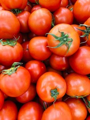 Close-up photo of tomatoes (Beef tomato) in market. Fruit and vegetable background. Texture red tomato. 