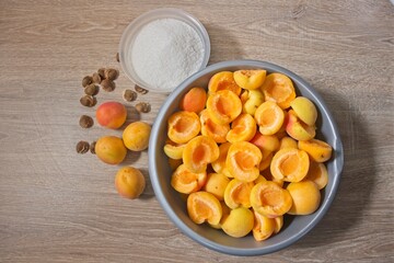 Apricot halves in a bowl, preparation for making preserves or jam