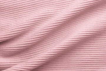 Fototapeta na wymiar Knitted delicate pink fabric, ribbing texture with large folds