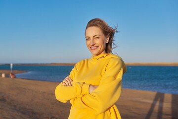 Outdoor portrait of a smiling confident woman 45 years old.