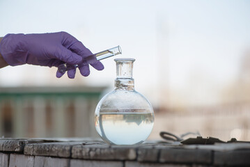 Water well pollution concept. Water well water sample examination concept.
