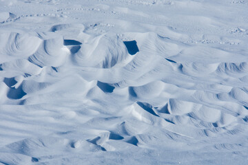 Fototapeta na wymiar Snowy desert in a field in the Canadian countryside in Quebec