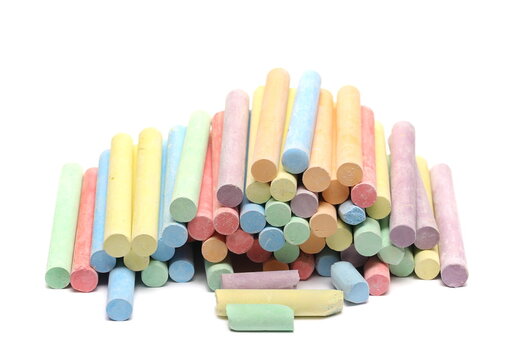 Colorful chalks pile isolated on white 