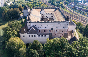 Fototapeta na wymiar Aerial view of Zvolen castle in Slovakia with Renaissance palace, outer ring of wall, turrets, corner tower, massive gate tower, Gothic Chapel
