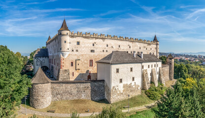 Fototapeta na wymiar Aerial view of Zvolen castle in Slovakia with Renaissance palace, outer ring of wall, turrets, corner tower, massive gate tower, Gothic Chapel