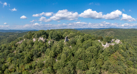 Obraz premium Aerial view of medieval castle ruin Szadvar above the village of Szogliget in Northern Hungary along the border with Slovakia, excavated and newly conserved