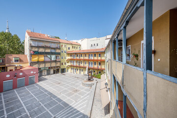 Old buildings with typical corrala of the Lavapies neighborhood in Madrid