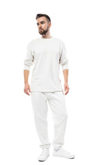 Handsome man wearing white long-sleeved t-shirt and pants on white background