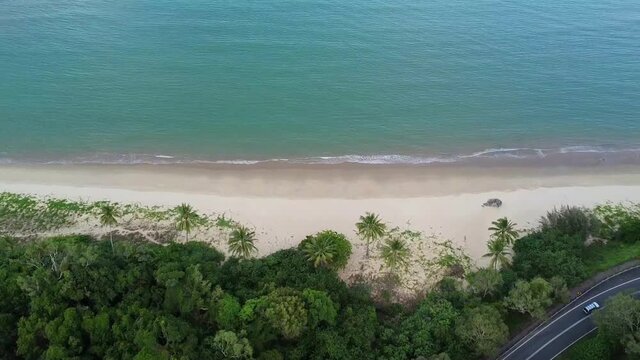 Aerial down view senic road next to beach