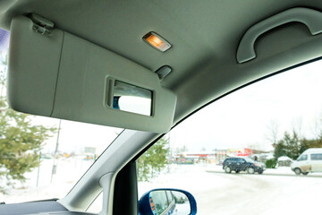 Sun visors for the car interior with a sliding mirror and lighting.