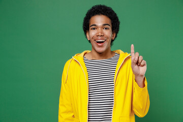 Insighted smart proactive young black curly man 20s years old wears yellow waterproof raincoat...