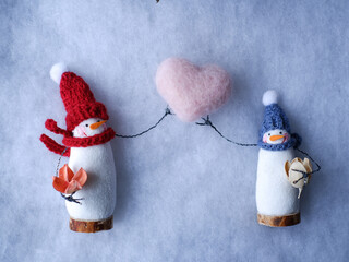 snowman with heart on white background