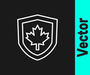 White line Canada flag on shield icon isolated on black background. Vector