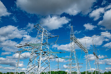 High voltage electrical network against the blue sky