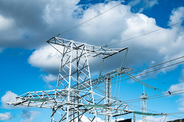 High voltage electrical network against the blue sky