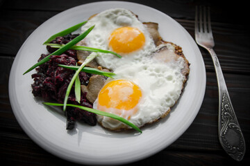 Breakfast fried eggs in lard