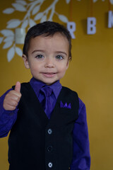 portrait of elegant little boy gesturing