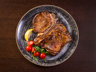 top view plate with Florentine steak on the bone
